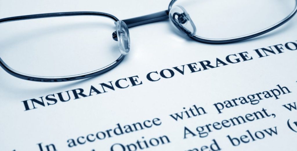 insurance coverage document with glasses