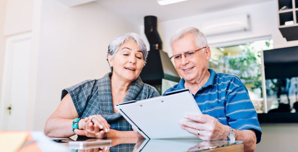 retired couple looking at paperwork